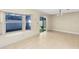 Bright dining area with tile floor, sliding doors to backyard, and a modern chandelier at 9517 Brackin St, Orlando, FL 32825