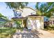 Charming two-story home featuring an attached garage and well-maintained front yard landscaping at 9517 Brackin St, Orlando, FL 32825