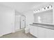 Pristine bathroom with dual sink vanity, granite countertop, a glass-enclosed shower and modern fixtures at 1792 Aurora Oak Ln, Sanford, FL 32771