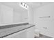Bathroom featuring a vanity with a granite countertop, a large mirror, and modern lighting at 1792 Aurora Oak Ln, Sanford, FL 32771