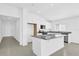 Bright kitchen featuring white cabinetry, stainless steel appliances, and a large granite island at 1792 Aurora Oak Ln, Sanford, FL 32771