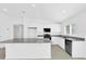Contemporary kitchen featuring granite countertops, stainless steel appliances, and white cabinets at 1792 Aurora Oak Ln, Sanford, FL 32771