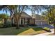 Well-maintained home with an attached three-car garage, and a lush front yard at 1913 Westover Reserve Blvd, Windermere, FL 34786