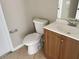 Cozy bathroom featuring a toilet and vanity with a sink and faucet at 2708 Smithfield Dr, Orlando, FL 32837