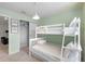bedroom with a built-in bunk bed at 7420 Oakmoss Loop, Davenport, FL 33837