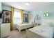 Toy Story themed bedroom with twin beds and wall art at 7420 Oakmoss Loop, Davenport, FL 33837