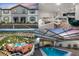 Real estate listing showcasing the property's exterior, interior, pool and community amenities in a collage at 7420 Oakmoss Loop, Davenport, FL 33837