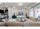 Spacious living area with comfortable seating and large TV at 7420 Oakmoss Loop, Davenport, FL 33837