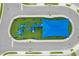 An aerial view of a playground with a large blue shade structure at 7420 Oakmoss Loop, Davenport, FL 33837