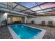 Private pool with covered lanai, perfect for outdoor relaxation and entertaining at 7420 Oakmoss Loop, Davenport, FL 33837