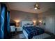 Comfortable bedroom featuring a plush bed, modern furniture, and soft lighting at 881 Orchid Grove Blvd, Davenport, FL 33837