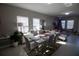Open-concept dining area featuring tile flooring, a modern table set, and natural light from the windows at 881 Orchid Grove Blvd, Davenport, FL 33837