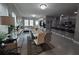 Open-concept area with elegant dining and living space with a sleek kitchen at 881 Orchid Grove Blvd, Davenport, FL 33837