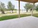 The back porch overlooks a lovely lake at 1208 Sawgrass Pointe Dr, Orlando, FL 32824