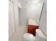 A simple bathroom features a single vanity and a toilet at 1208 Sawgrass Pointe Dr, Orlando, FL 32824