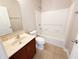 Functional bathroom features a vanity with a neutral countertop and a shower-tub combo, maximizing space at 1208 Sawgrass Pointe Dr, Orlando, FL 32824