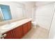 Bathroom features a single vanity and a shower over tub at 1208 Sawgrass Pointe Dr, Orlando, FL 32824