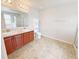 Bathroom features a double vanity and a separate shower and toilet at 1208 Sawgrass Pointe Dr, Orlando, FL 32824