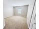 Bedroom featuring neutral carpet, one window and a built in closet at 1208 Sawgrass Pointe Dr, Orlando, FL 32824