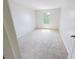 A bright bedroom with neutral carpeting and a view of the window at 1208 Sawgrass Pointe Dr, Orlando, FL 32824