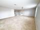 Spacious carpeted bonus room with open floor plan, neutral colors and bright lighting at 1208 Sawgrass Pointe Dr, Orlando, FL 32824