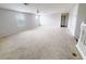 Spacious bonus room featuring neutral carpet, windows and an open floor plan at 1208 Sawgrass Pointe Dr, Orlando, FL 32824
