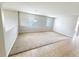 Neutral bonus room with carpet and tile flooring and two windows offering plenty of natural light at 1208 Sawgrass Pointe Dr, Orlando, FL 32824