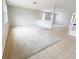 Neutral bonus room with carpet and tile flooring and one windows offering plenty of natural light at 1208 Sawgrass Pointe Dr, Orlando, FL 32824