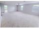 Spacious bonus room boasts carpet floors, windows and an open floor plan at 1208 Sawgrass Pointe Dr, Orlando, FL 32824