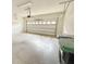 Spacious two car garage features an automatic door and generous room for storage at 1208 Sawgrass Pointe Dr, Orlando, FL 32824