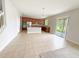 Expansive kitchen with stainless steel appliances, ample counter space, and sliding glass doors to the backyard at 1208 Sawgrass Pointe Dr, Orlando, FL 32824