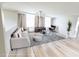Bright living room features hardwood floors, stylish furniture, modern lighting, and neutral color palette at 1208 Sawgrass Pointe Dr, Orlando, FL 32824