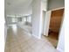 Spacious living area offers a glimpse into an open layout, leading to a bathroom and other living spaces at 1208 Sawgrass Pointe Dr, Orlando, FL 32824