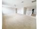 Expansive carpeted living room offers neutral colors and bright lighting for easy customization at 1208 Sawgrass Pointe Dr, Orlando, FL 32824