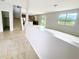 Spacious living area featuring a stairway, window, and open layout, making it perfect for entertaining guests at 1208 Sawgrass Pointe Dr, Orlando, FL 32824