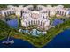 Aerial view of resort community with lake and multiple buildings at 14501 Grove Resort Ave # 3640, Winter Garden, FL 34787