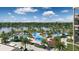 Aerial view of community pool and lakefront at 14501 Grove Resort Ave # 3640, Winter Garden, FL 34787