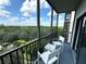 Private screened balcony overlooking lush treetop views at 14501 Grove Resort Ave # 3640, Winter Garden, FL 34787