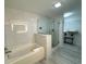 Spa-like bathroom with soaking tub, walk-in shower, and modern vanity at 14501 Grove Resort Ave # 3640, Winter Garden, FL 34787