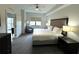 Spacious bedroom with king-size bed and ensuite bathroom at 14501 Grove Resort Ave # 3640, Winter Garden, FL 34787