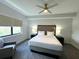 Comfortable bedroom with king-size bed and window seat at 14501 Grove Resort Ave # 3640, Winter Garden, FL 34787