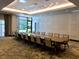 Long conference table with chairs in a well-lit room at 14501 Grove Resort Ave # 3640, Winter Garden, FL 34787