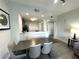 Kitchen features breakfast bar and dining space at 14501 Grove Resort Ave # 3640, Winter Garden, FL 34787