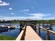 Wooden dock with gazebo offers scenic lake views at 14501 Grove Resort Ave # 3640, Winter Garden, FL 34787