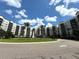 Resort-style community with fountain and palm trees at 14501 Grove Resort Ave # 3640, Winter Garden, FL 34787