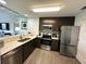 Modern kitchen with stainless steel appliances at 14501 Grove Resort Ave # 3640, Winter Garden, FL 34787