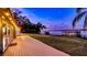 Spacious backyard with a wooden deck and private dock on the serene lake at 647 Ridgewood Dr, Windermere, FL 34786