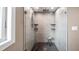 Updated bathroom with a walk-in shower and pebble floor at 647 Ridgewood Dr, Windermere, FL 34786