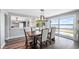Dining room with a large window offering a view of the water and access to a patio at 647 Ridgewood Dr, Windermere, FL 34786