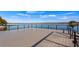 Modern dock with sleek black railings providing stunning views of the calm lake and distant shoreline at 647 Ridgewood Dr, Windermere, FL 34786